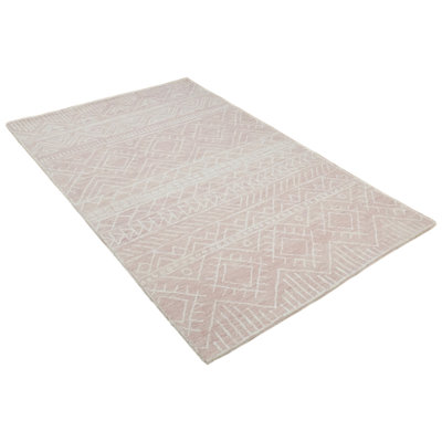 Tapis rose en laine fabriqué à la main d'inspiration tribale