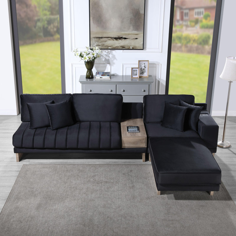 Canapé modulaire réversible en velours avec repose-pieds, ports USB et prises de recharge pour les espaces de vie modernes.