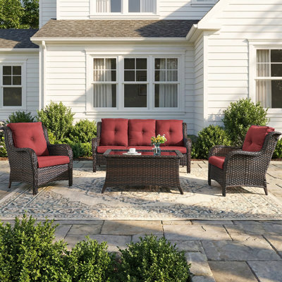 L'ensemble de canapé d'extérieur 4 pièces comprend un canapé de patio en osier avec des coussins en oléfine épaissis, un dossier haut et des sièges profonds, du rotin en PE tissé à la main et 2 fauteuils, 1 table basse pour le porche, une terrasse