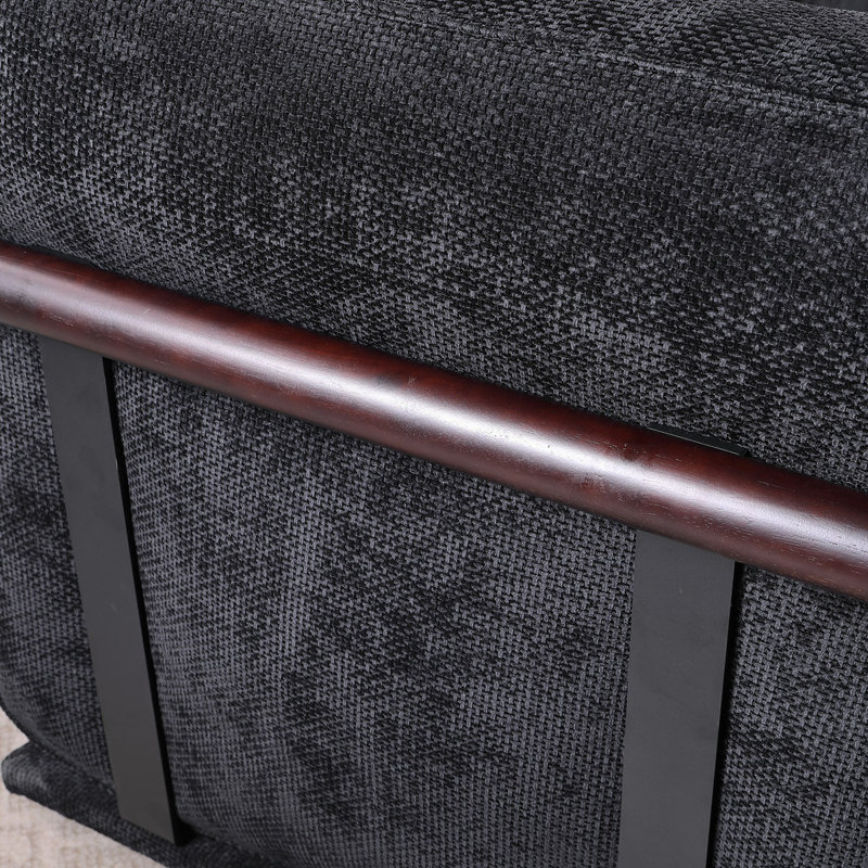 Ceci est un ensemble de canapé modulaire en tissu, comprenant un module d'angle et plusieurs sièges indépendants, jumelé avec des repose-pieds carrés du même matériau.