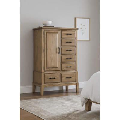 La commode et la commode avec finition en bois et poignées en métal foncé combinent chaleur rustique et rangement spacieux pour la chambre à coucher