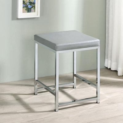 Tabouret de coiffeuse moderne sans dossier gris avec siège carré en mousse et base rembourrée élégante