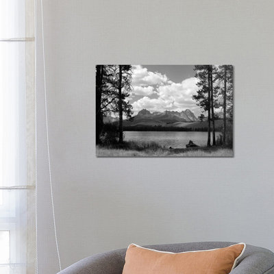 1960s Little Red Fish Lake In Idaho With Saw Tooth Mountains In Background Viewed Between Clearing In Trees by Vintage Images - Wrapped Canvas Print