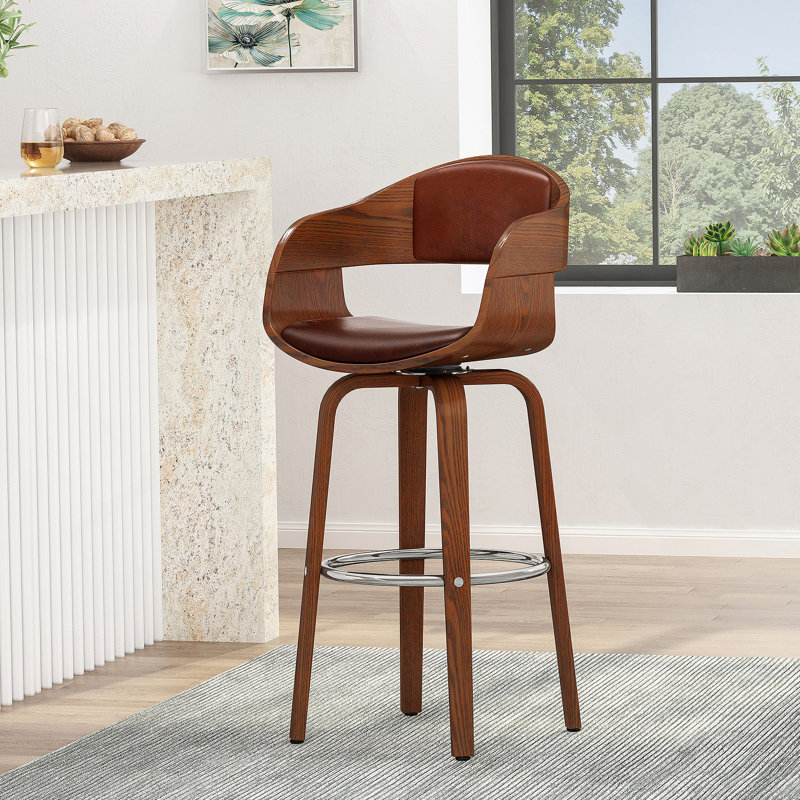 Élégant tabouret de bar rembourré avec une assise confortable et une fabrication durable, pour les cuisines et les bars modernes.