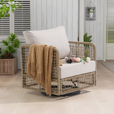 Chaise pivotante d'extérieur en osier avec coussins