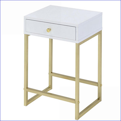 Table basse blanche et laiton avec tiroir, rangement compact pour le salon