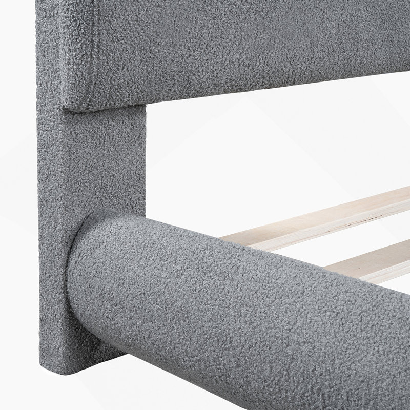 Lit plateforme tapissier avec tissu épais, structure solide et design élégant en forme de courbe