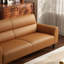 Canapé double en cuir orange, équipé de coussins-51298867
