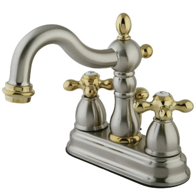Robinet de salle de bain central à deux poignées et 3 trous à fixation sur le comptoir de 4 po avec bonde escamotable en plastique Kingston Brass Heritage