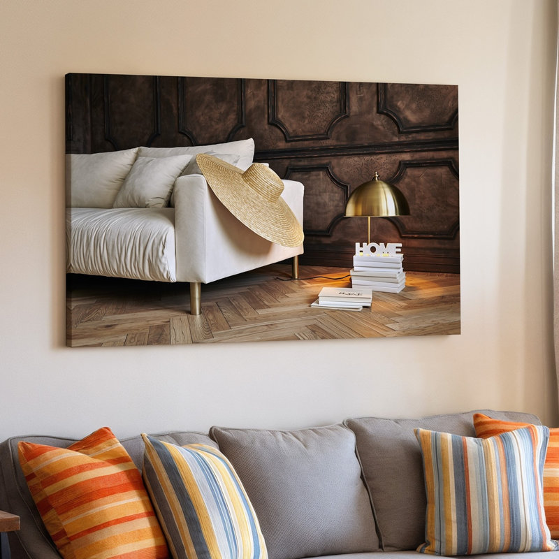 «Canvas A Cozy Contemporary Living Space» présente un art mural de canapé blanc moelleux avec une texture légèrement froissée ornée d'un large art mural sur toile