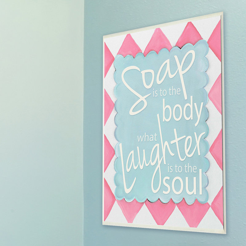 Le savon est au corps, quel est le rire pour l’âme, art textuel sur plaque murale