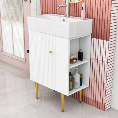 Meuble-lavabo élégant avec lavabo en céramique, rangement à droite et détails dorés