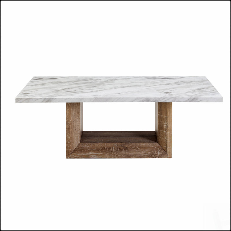 Table basse luxueuse à finition marbrée, parfaite pour ajouter de l'élégance et du style au décor de votre salon.