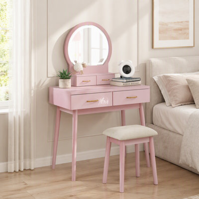 Charmante commode de coiffeuse à finition rose avec miroir, tabouret et tiroirs de rangement pour un décor de chambre à coucher élégant