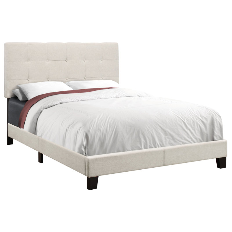 Lit double avec magnifique revêtement en lin beige et pieds revêtus de bois noir pour la chambre à coucher