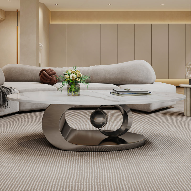 Table basse en marbre avec base sculpturale en acier inoxydable