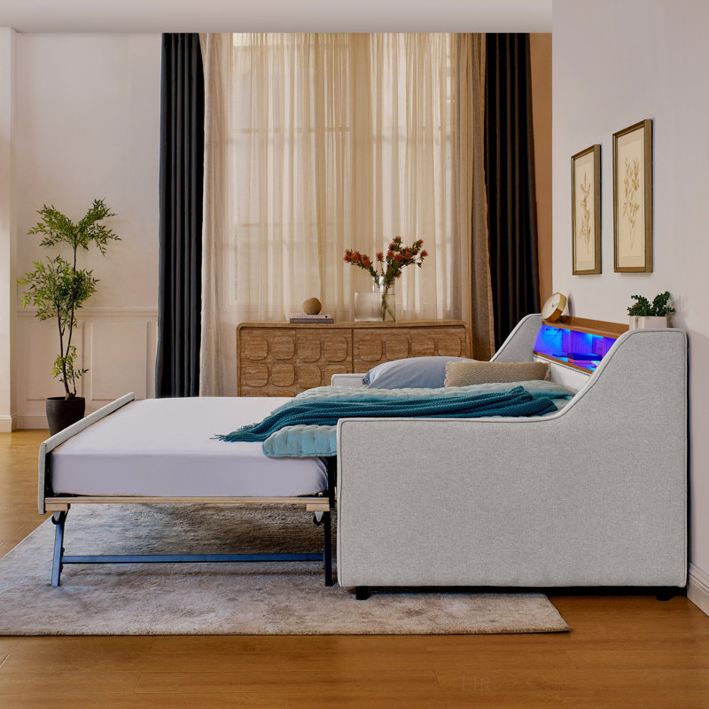 Canapé-lit simple rembourré avec trois lumières DEL, une tête de lit réglable avec rangement, un lit gigogne rabattable avec pieds pliables et une recharge sans fil