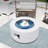 40,000 BTU 28 in. Round Iron Propane Fire Pit Table with Tank Cover and Glass Wind Guard in White-1655041856