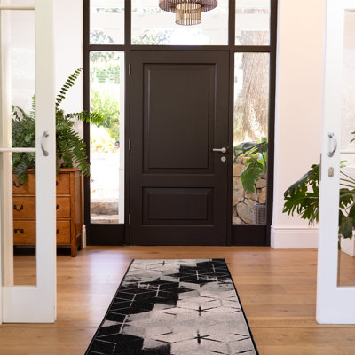 Tapis noir touffeté à motif géométrique Broschard