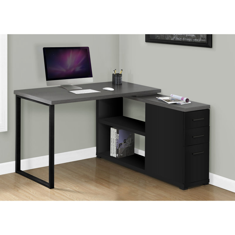 Bureau d'ordinateur moderne en forme de L, noir et gris, avec rangement, plateau en stratifié gris, tiroirs et design fonctionnel.