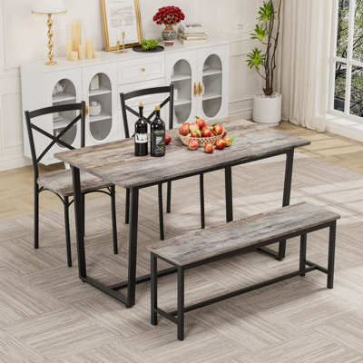 Ensemble de table et de chaises de style industriel quatre pièces avec dossier, structure solide pour des espaces de salle à manger polyvalents