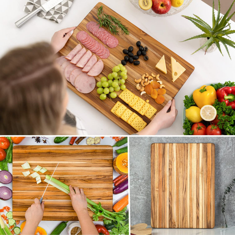 https://assets.wfcdn.com/im/54433080/resize-h755-w755%5Ecompr-r85/2319/231982981/Teak+Wood+Cutting+Board+With+Hand+Grip+Wooden+Cutting+Boards+For+Kitchen+Medium+Chopping+Board+Wood+Christmas+Exchange+Gifts%2820+X+15+X+1.25+Inches%29.jpg