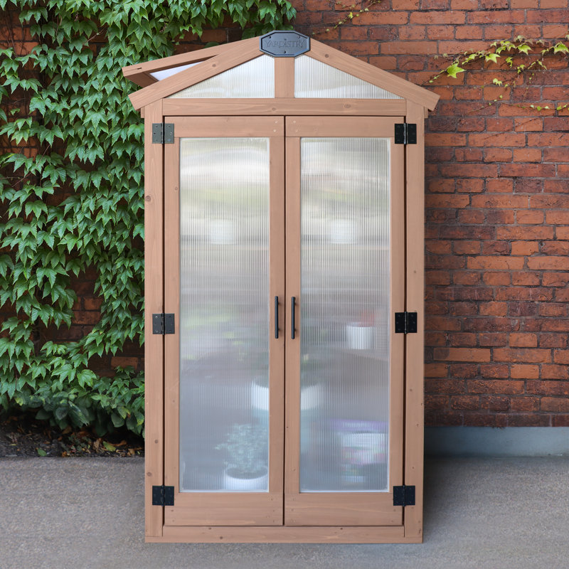 Urban Greenhouse with Cedar Wood Frame and Polycarbonate Panels Compact Modern Design for Small Spaces