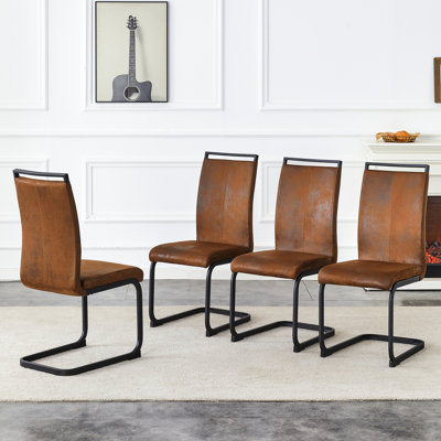 Ensemble de 4 chaises de salle à manger de style rétro, revêtues d'un tissu technique effet suède, avec pattes en métal noir, antidérapantes, ergonomiques et confortables, pour une utilisation stable.