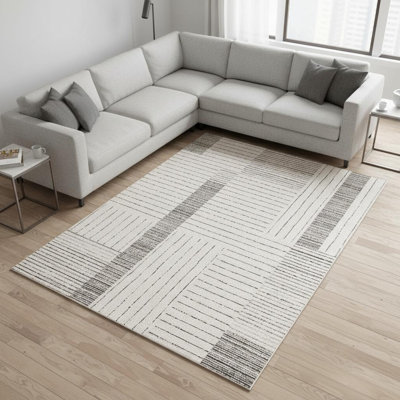 Tapis rayé noir et ivoire 8 pi x 11 pi