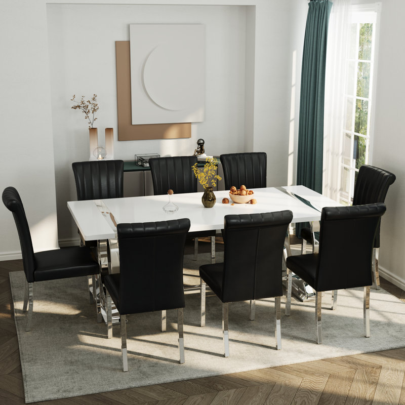Table de salle à manger de luxe moderne avec plateau rectangulaire laqué brillant et base circulaire en acier inoxydable