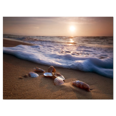 " Waves Approaching Seashells On Sand "