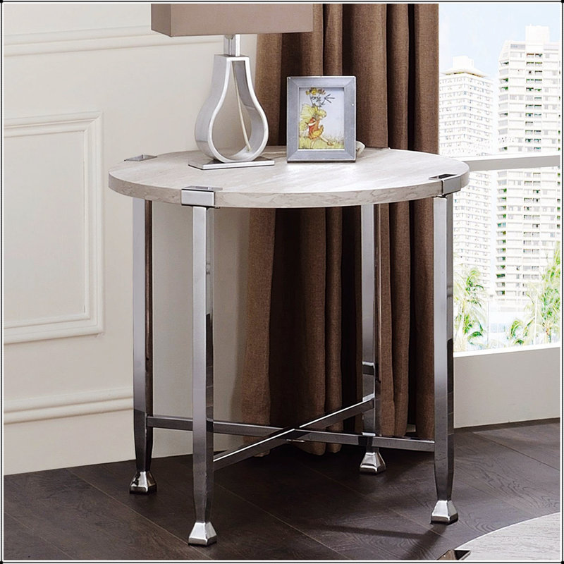 Table de bout ronde avec support en forme de X, design moderne et minimaliste pour plus de stabilité et de style dans tout espace de vie.