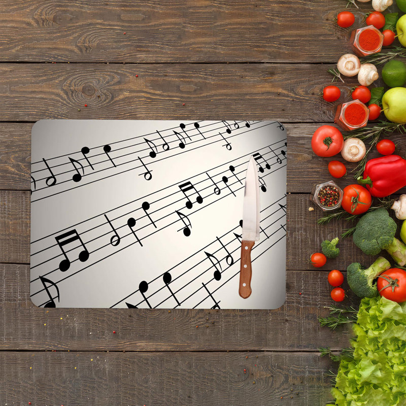 Planche à découper à thème musical avec un musicien et des notes de musique sur un matériau en verre durable, idéal pour la cuisine et la préparation des aliments