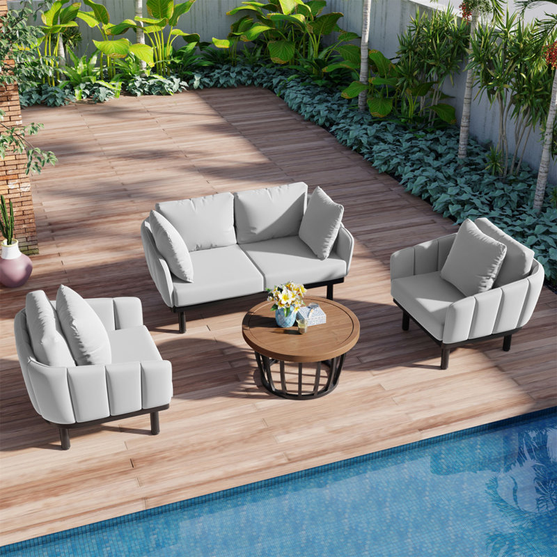 Ensemble de conversation luxueux avec cadre en fer et table basse en bois d'acacia pour divers espaces