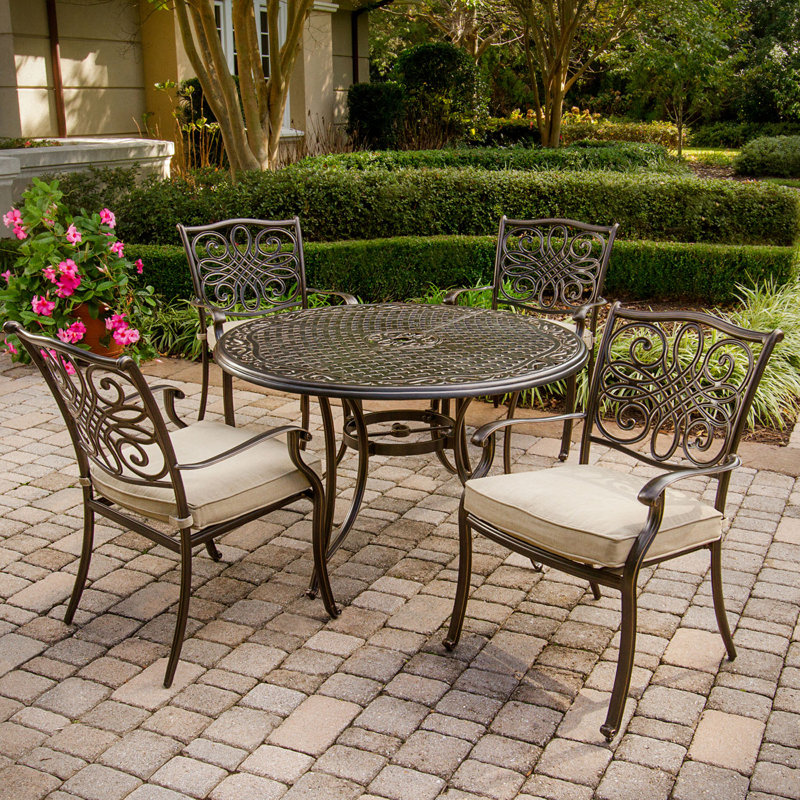 Burroughs 4 - Person Patio Dining Set with Round Table , Cushions Included