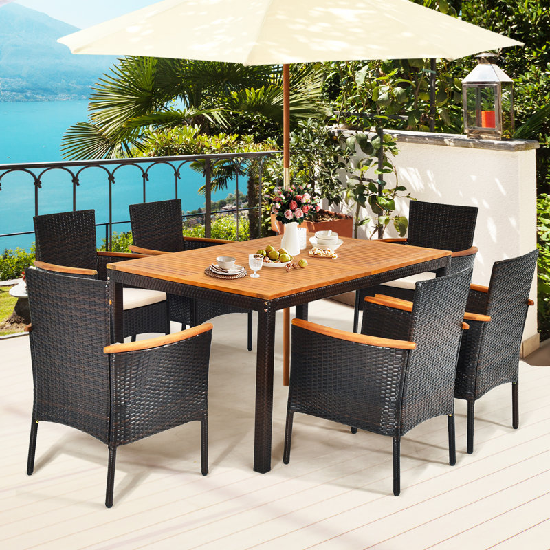 Nadkar 6 - Person Acacia Wicker Patio Dining Set with Rectangular Table , Cushions Included