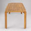 Table de salle à manger d'extérieur Kaja en bois d'acacia, finition teck, avec un design à lattes pour un mobilier de patio durable et élégant.
