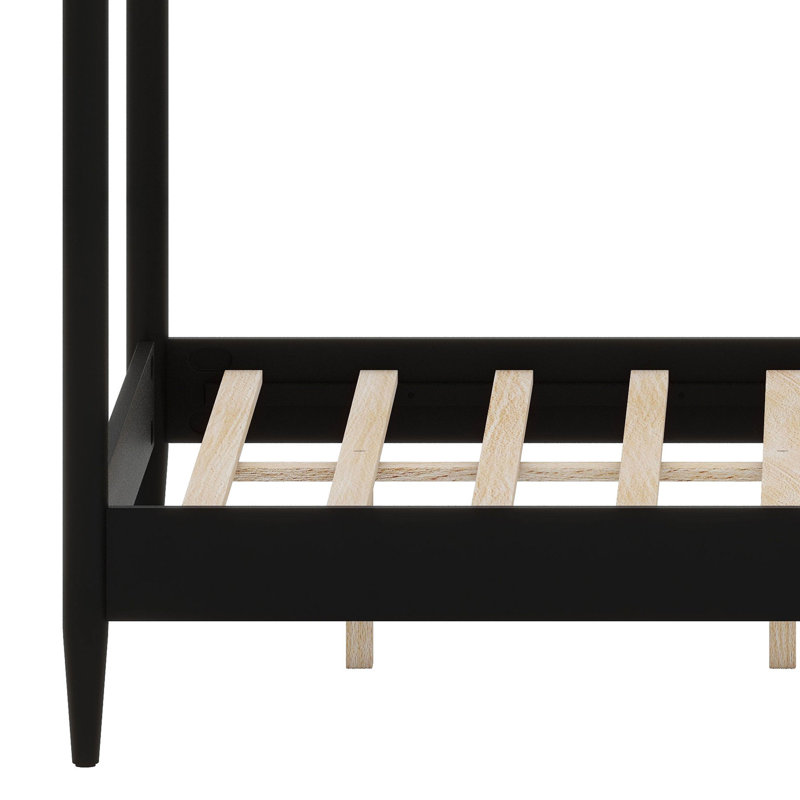 Cadre de lit à baldaquin avec tête de lit moelleuse et design à quatre colonnes fuselées pour un style moderne du milieu du siècle