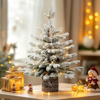 Pre-Lit Potted Flocked Arctic Fir Artificial Christmas Tree.