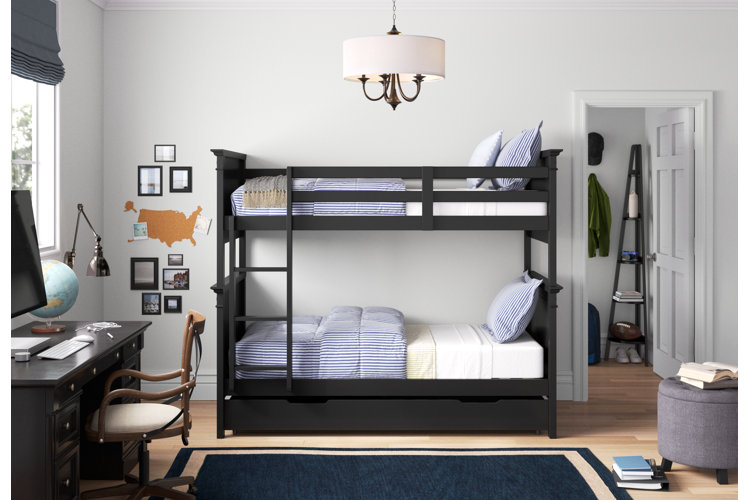 espresso wood twin-over-twin bunk bed with striped comforters and white sheets