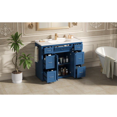 Meuble-lavabo bleu marine 48 po avec lavabo en céramique - 6 tiroirs (3 de chaque côté), tiroir central rabattable, portes doubles à fermeture en douceur, porte-serviettes latéral réversible, poignées argentées, panneau de fibres à densité moyenne