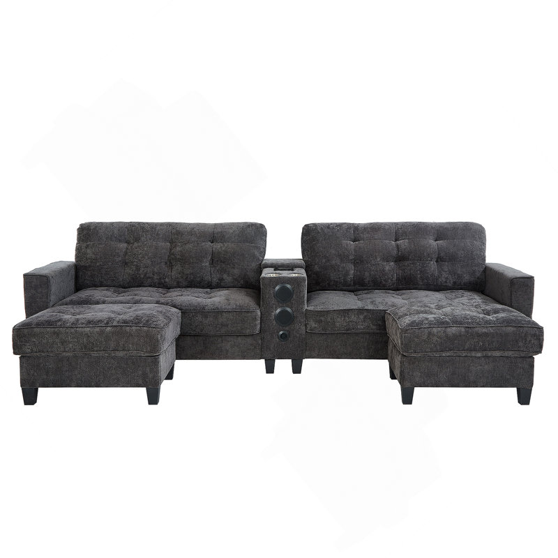 Canapé modulaire moderne en forme de U avec repose-pieds, console, haut-parleurs Bluetooth et lumières DEL pour le confort et le divertissement du salon.