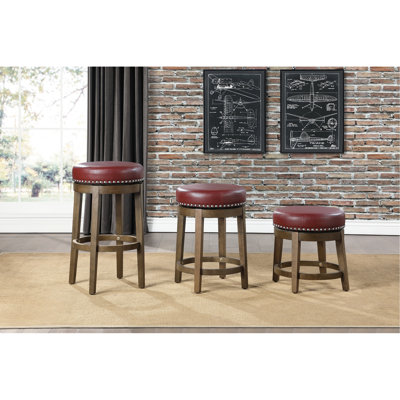Tabourets ronds et pivotants de 2, revêtement en similicuir rouge, structure en bois massif au fini brun avec garniture cloutée fonctionnelle pour la salle à manger