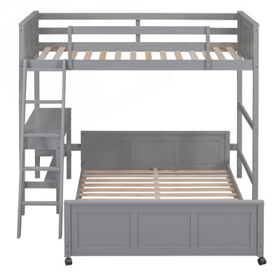 Lit simple superposé au dessus d'un lit double avec bureau intégré