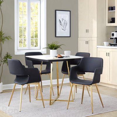 Table avec base en métal doré et bois noir avec plateau en céramique effet marbre blanc