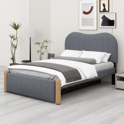 Gulbranson Upholstered Panel Bed with Wood Supporting Feet and Trundle