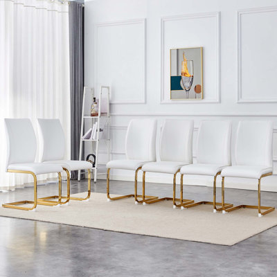 Ensemble de 6 chaises de salle à manger en polyuréthane haute résilience avec pieds arqués en métal doré.