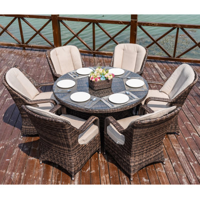 Algird 6 - Person Wicker Patio Dining Set with Round Table , Cushions Included