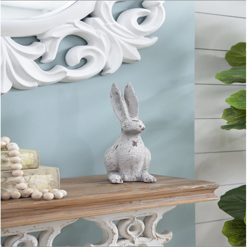 Statue de lapin en ciment patiné