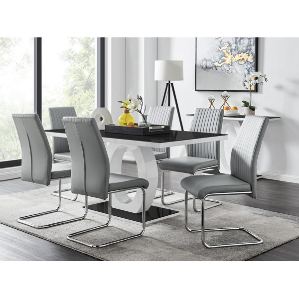 https://assets.wfcdn.com/im/54714485/resize-h600-w600%5Ecompr-r85/1234/123419628/Scottsmoor+Modern+High+Gloss+Halo+6+Seater+Dining+Table+Set+with+Luxury+Faux+Leather+Dining+Chairs.jpg